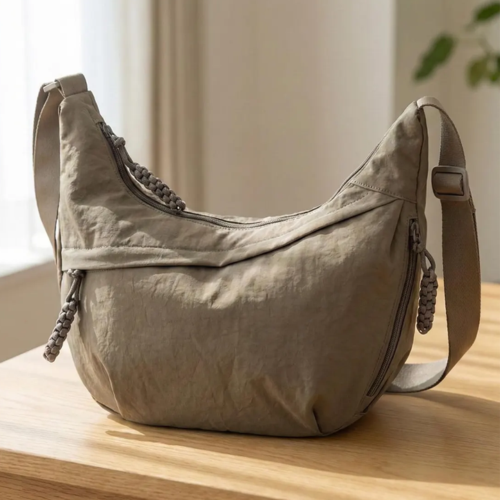 Wrinkled Fabric Crescent Hobo Pouch With Multi Zippered Exterior Pockets, Braided Cord Pull Tabs And Wide Woven Hanging Strap